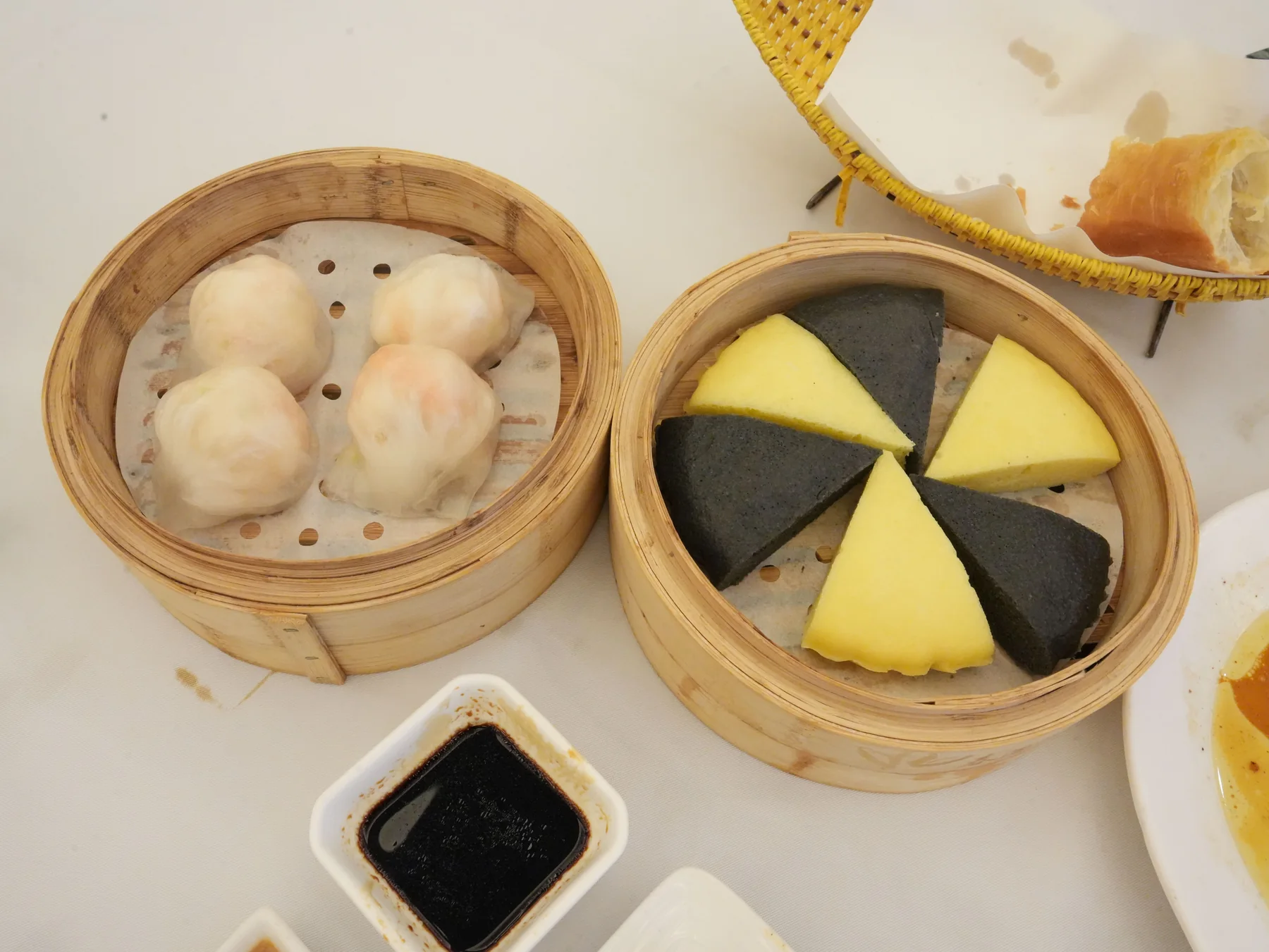 Assorted dim sum dishes in bamboo steamers
