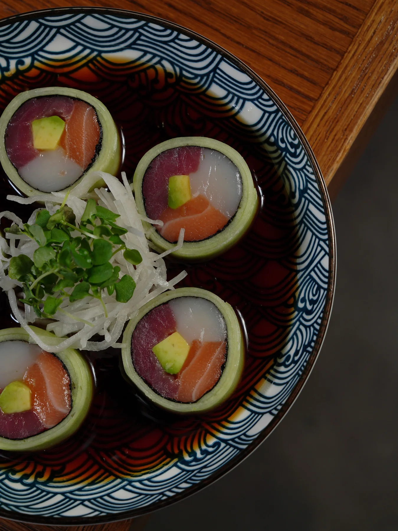Sushi with fish, rice and fresh vegetables in an artistic presentation