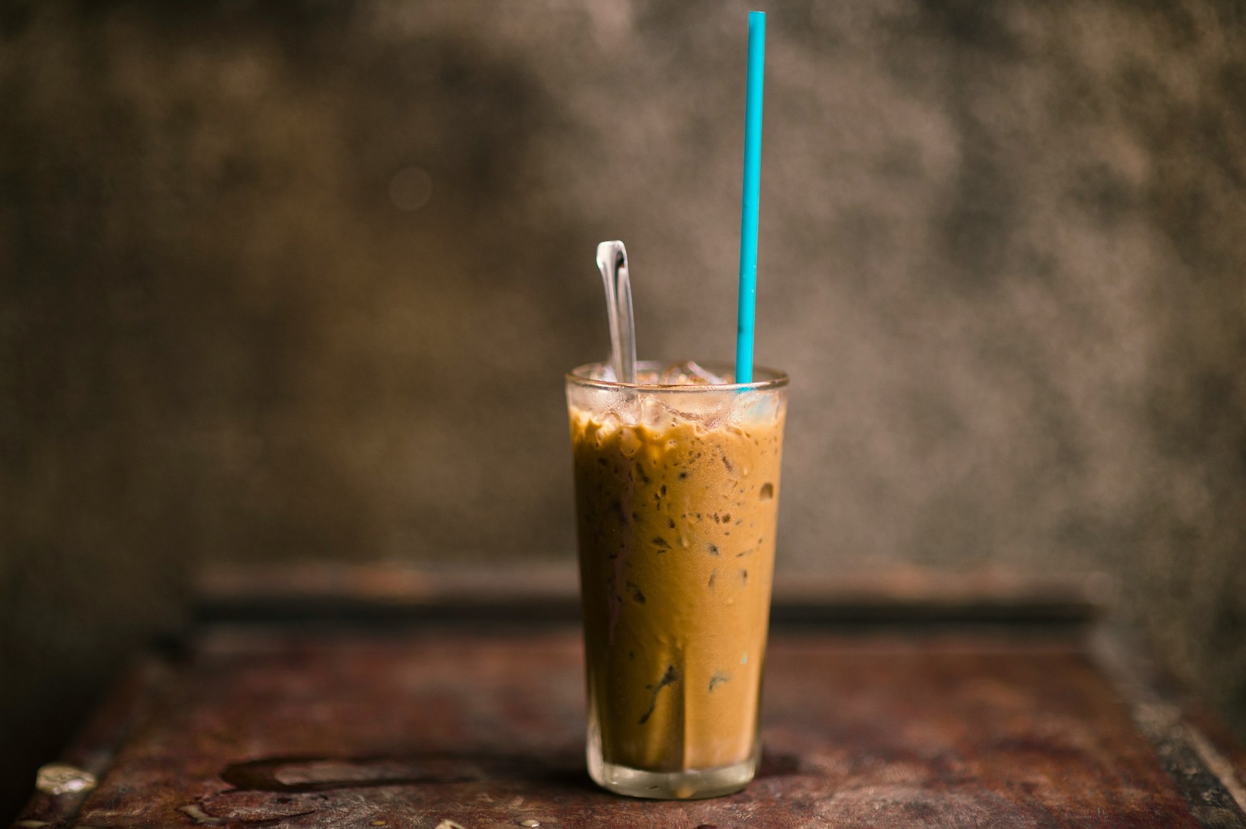 Vietnamese iced coffee with ice in a tall glass